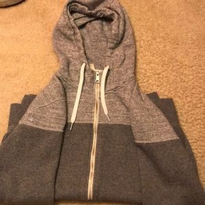 A light grey jacket with a hoodie.